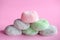 Mochi colorful japanese rice cakes stacked on pink