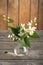 Mock-orange flowers twigs in a small pot