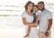 A mock up black family on holiday, happy at beach and smile in summer sun. Mother with her man, girl child on seaside