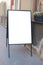 Mock up. Blank board menu white board near cafe, bar, restaurant, shop in the street