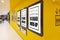 Mock up blank poster in brown frames on yellow wall