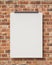 Mock up blank white hanging poster on brick wall, background