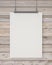 Mock up blank white hanging poster on horizontal wooden planks wall, background