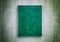 Mock up book green color on grunge background close-up