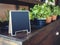 Mock up Chalkboard stand with organic herb plants on shelf
