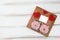 Mock up for congratulations on the holiday in the form of a wooden Board with the image of hearts and piglets of thread and paper