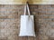 Mock up Cotton Tote Bag on Brick wall Background