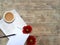 Mock up flatlay with red daisies, notepad and coffee  on wooden background