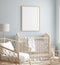 Mock up frame in boy nursery with natural wooden furniture