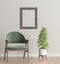 Mock up frame in living room interior with green velvet armchair and plant