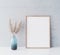 Mock up frame in minimal interior with blue vase and dried pampas, Scandinavian style