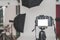 Mock up of a professional camera, in a photo studio, against the background of softbox light sources