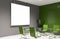 Mock up screen in green and gray meeting room