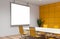 Mock up screen in yellow and white meeting room