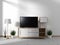 Mock up Smart Tv Mockup with blank black screen hanging on the cabinet decor, modern living room zen style. 3d rendering