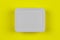 Mock-up white plastic box on yellow background top view, disposable packaging for products