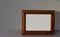 Mock up of wooden picture frame on modern counter