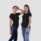 Mockup of black Ñouple t-shirt on girls in jeans, isolated on background, front view