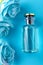 Mockup of blue fragrance with blue roses Female perfume beauty on a blue background