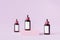 Mockup bottles with label for cosmetics products, template or advertising, pink background, 3d illustration render