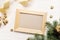 Mockup Christmas greeting card top view and wood frame, flatlay on a white wooden background with a ribbon, with place