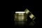 Mockup empty luxury golden cream jar for skincare and beauty skin is uncover, isolated on black background with clipping path.