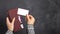 Mockup. A female hand holds a burgundy leather wallet with credit cards and takes out a blank business card