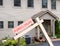 Mockup of foreclosure sign in front of modern townhome due to recession and pandemic