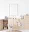 Mockup frame in minimal unisex child bedroom with natural wooden furniture