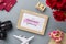 Mockup golden picture frame for travel with valentines day & love season background concept. Top view of mock up photo frame with