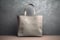 Mockup grey tote-bag. Shopper tote bag handbag on isolated black background. Copy space shopping eco reusable bag. Grocery