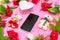 Mockup image of a smartphone\\\'s screen surrounded by dolls and flower