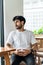 Mockup image of a young bearded man doing a pose while wearing white blank shirt