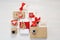 Mockup paper parcels wrapped tied with tags. A red heart and some christmas gift boxes wrapped with paper kraft and tied