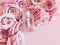 Mockup of perfume bottle and pink roses on a pastel pink background. Bottle for branding and label. Eau de toilette. Eau de parfum