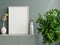 Mockup photo frame on the dark green cabinet with beautiful plants