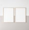 Mockup poster frame, two vertical wooden frames on beige and white wall