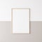 Mockup poster frame, vertical wooden frame on beige and white wall