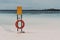 Mockup of safety banner on the beach with the lifebuoy