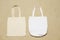 Mockup shopper handbag beach sand background. Top view copy space shopping eco reusable bag. Casual accessories. Template blank