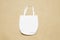Mockup shopper handbag beach sand background. Top view copy space shopping eco reusable bag. Grocery accessories. Template blank