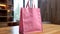 Mockup shopper pink tote bag handbag at home interior background. Copy space shopping eco reusable bag. Grocery accessories.