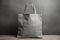 Mockup shopper tote bag handbag on isolated grey background. Copy space shopping eco reusable bag. Grocery accessories. Template