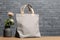 Mockup shopper tote bag handbag on isolated grey background. Copy space shopping eco reusable bag. Grocery accessories. Template