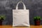 Mockup shopper white tote bag handbag on isolated grey background. Copy space shopping eco reusable bag. Grocery mock-up white