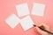 Mockup sticky Note Paper. Hand written notes black pencil on white sticker. pink table background. Mockup sticky Note Paper. empty