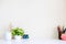 Mockup table with plant decorate, cup of coffee, water colour.