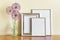 Mockup template with standing stack of silver frames and pink circular summer garlic flowers