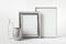 Mockup template with two blank silver frames, silver and glass small vases