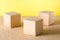 Mockup. Three textured cubes stand on a beige background